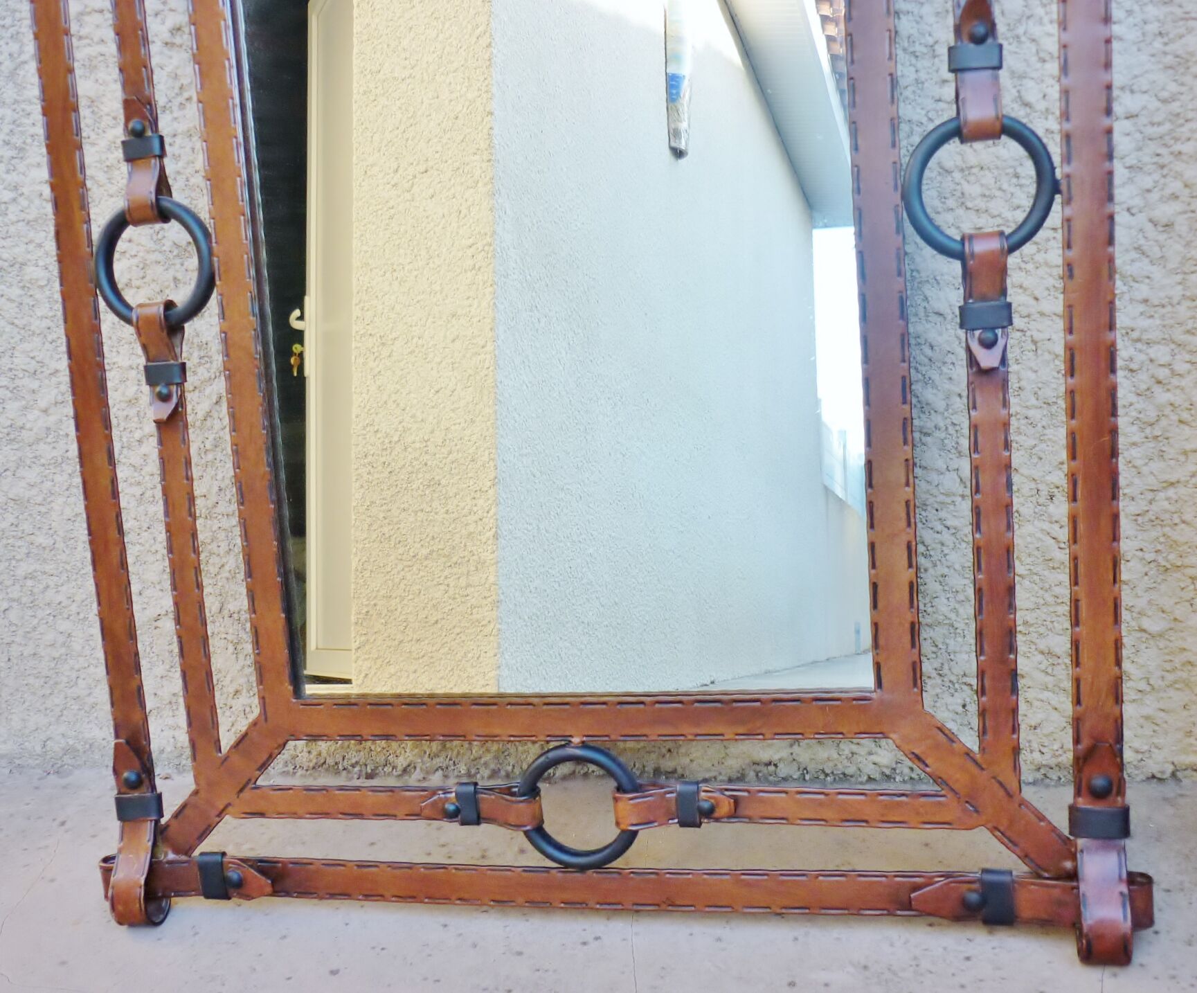 Metal mirror, wrought iron imitation leather straps and horse harness