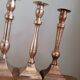 Set of 10 bronze-tinted brass candle holders 01 Pro
