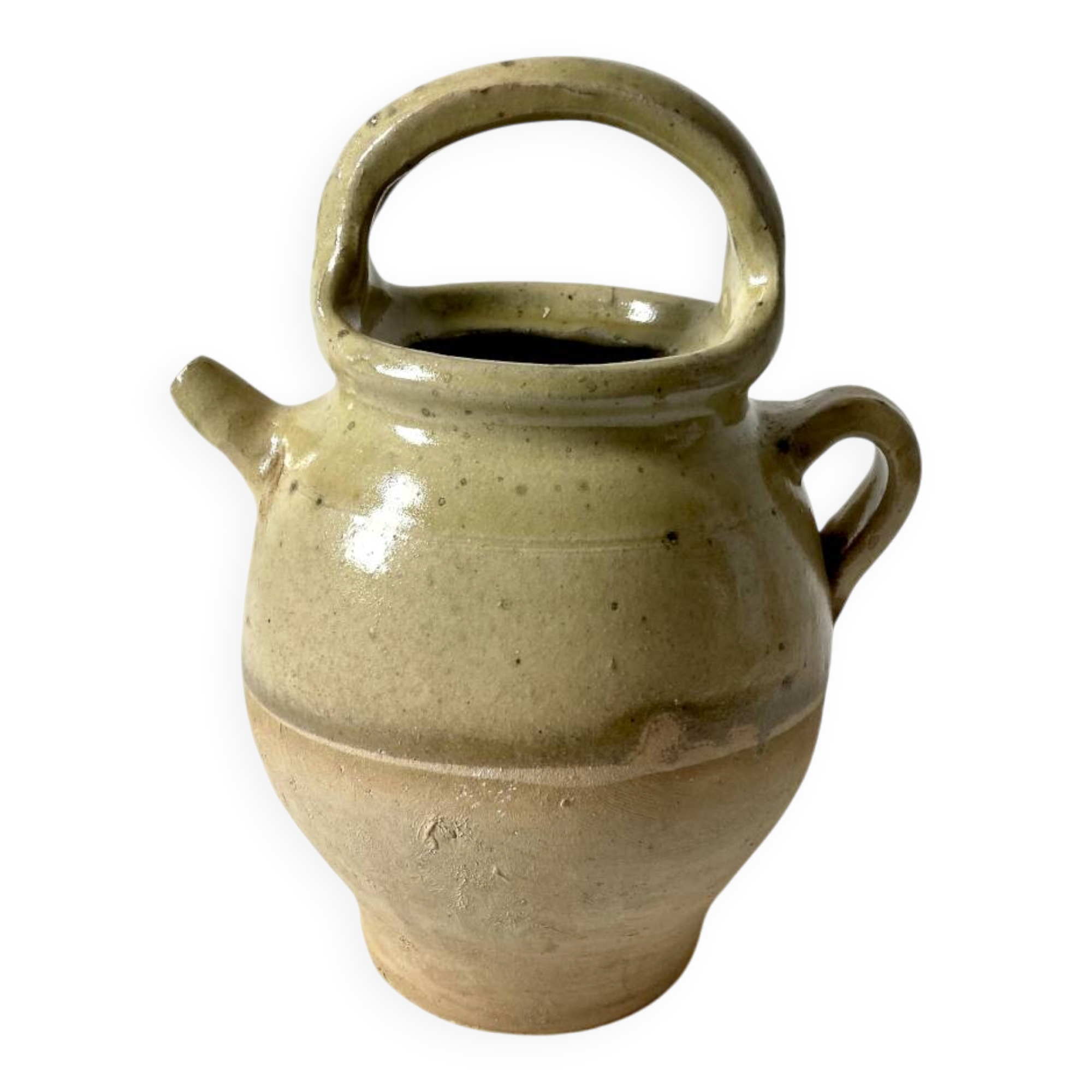 Old small goat-shaped jug in ochre glazed stoneware.