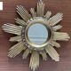 Vintage sun mirror in golden resin 60s/70s