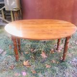 Extendable round table in walnut wood 1930