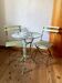 Vintage bistro set in wrought iron – 1930s table and folding chairs.
