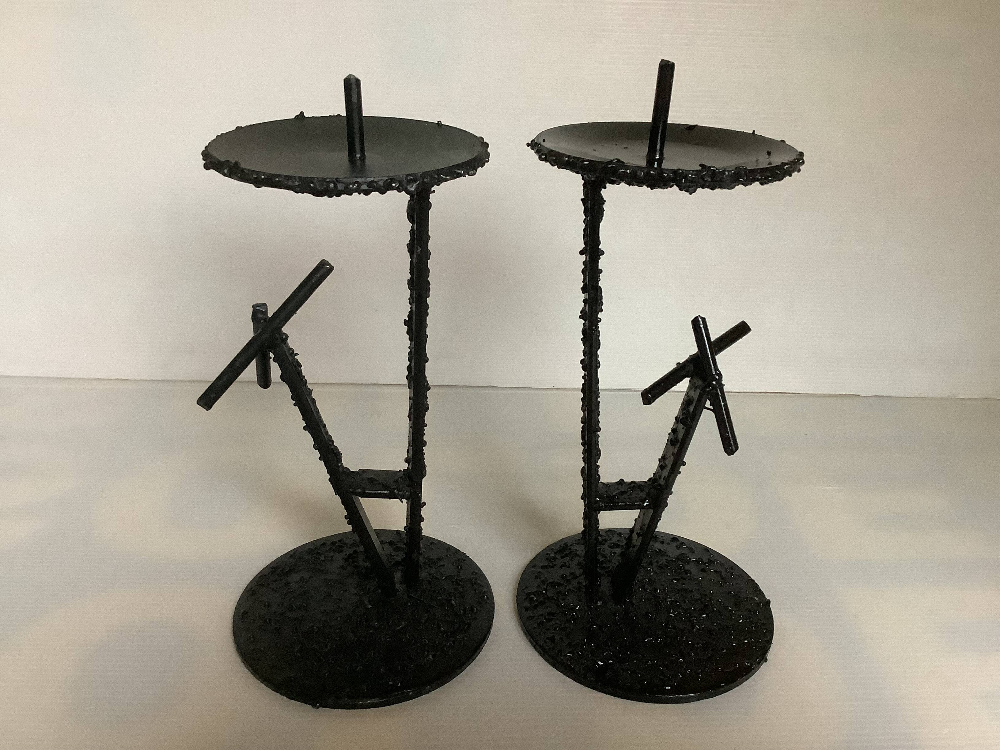 Pair of black metal candlesticks