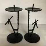 Pair of black metal candlesticks