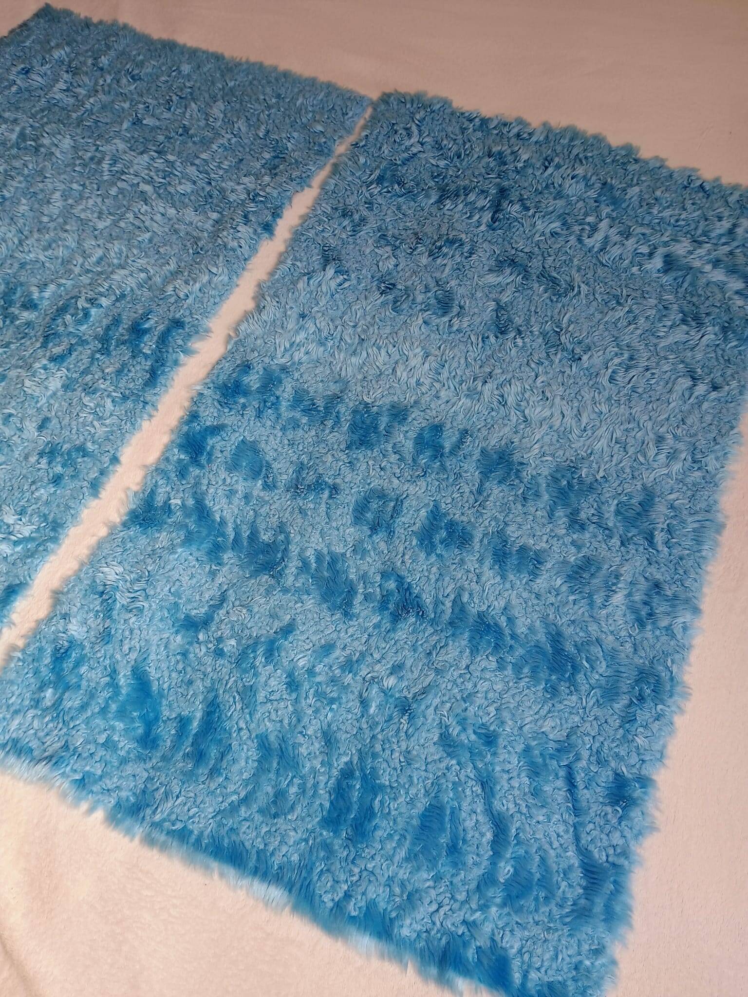 Set of two vintage sky blue rugs from the 70s