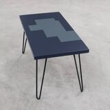 Design wooden coffee table with blue and grey patterns on pins feet