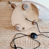 Vintage floor lamp in turned wood with aged effect.