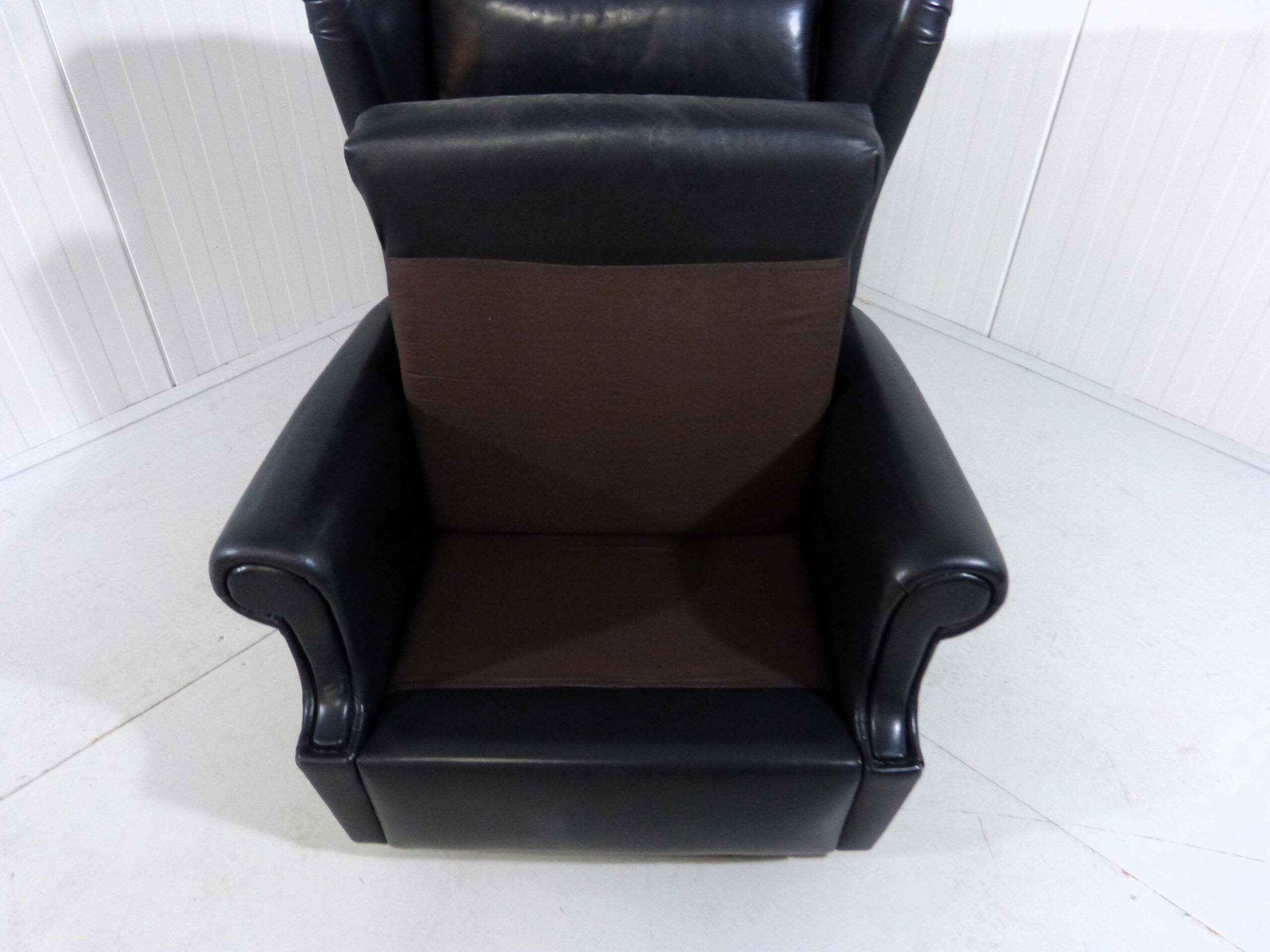 Black leather wingback chair on wheels 1960’s