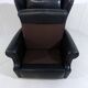 Fauteuil à oreilles en cuir noir sur roulettes années 1960