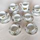 10 tea cups and creamer in Limoges porcelain