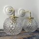 Set of two new electrified chiseled glass globe sconces