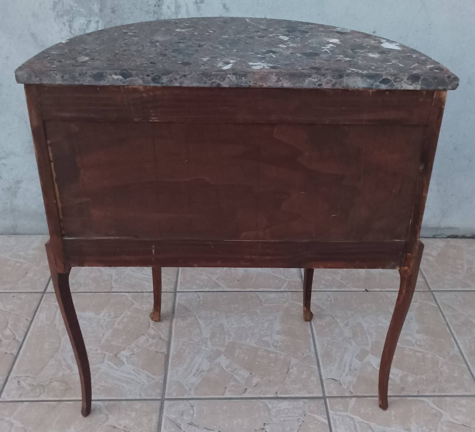 Half-moon commode in Louis XV style with walnut veneer.