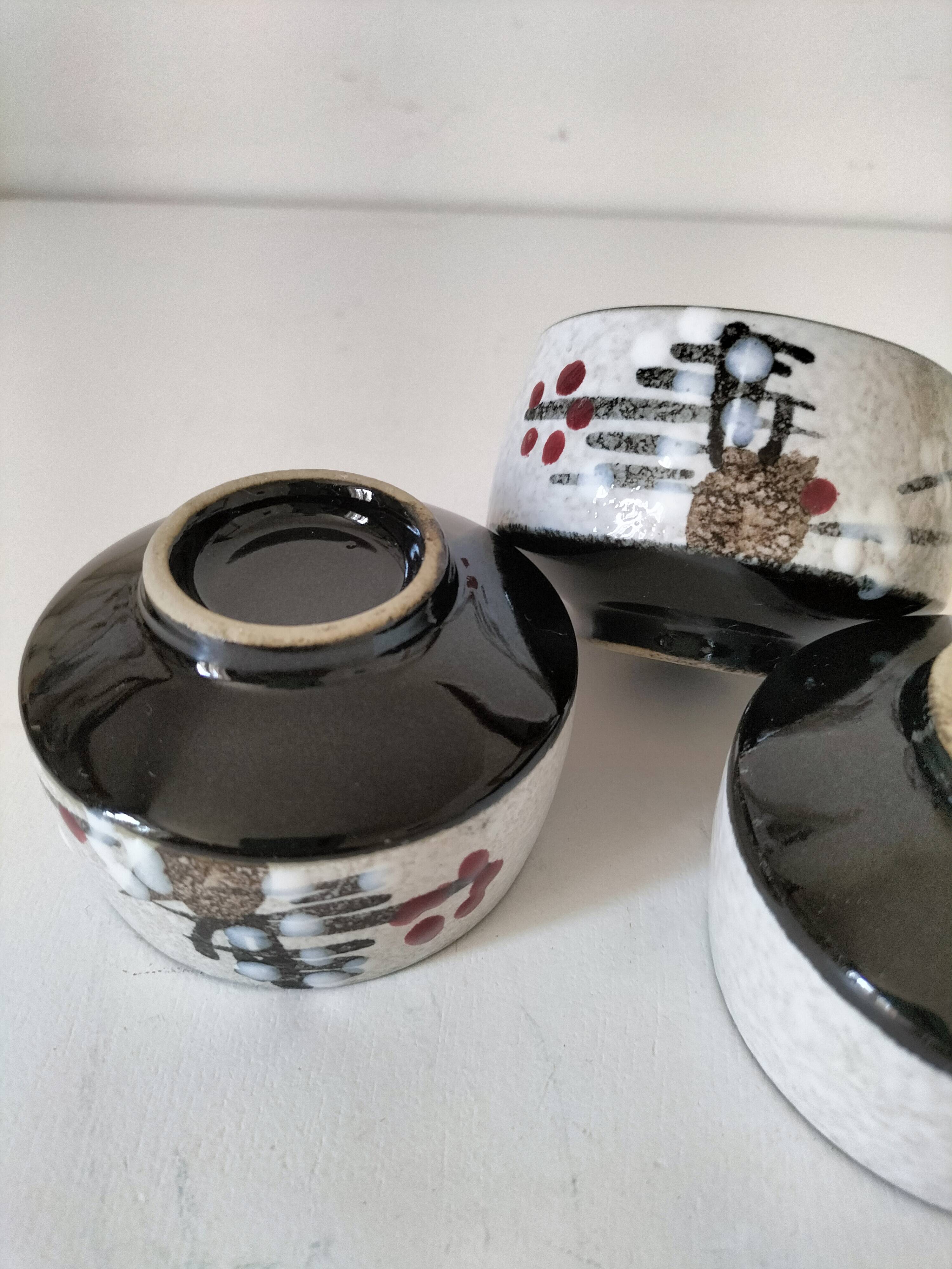 Three glazed ceramic bowls with raised graphic decoration, 1970s.