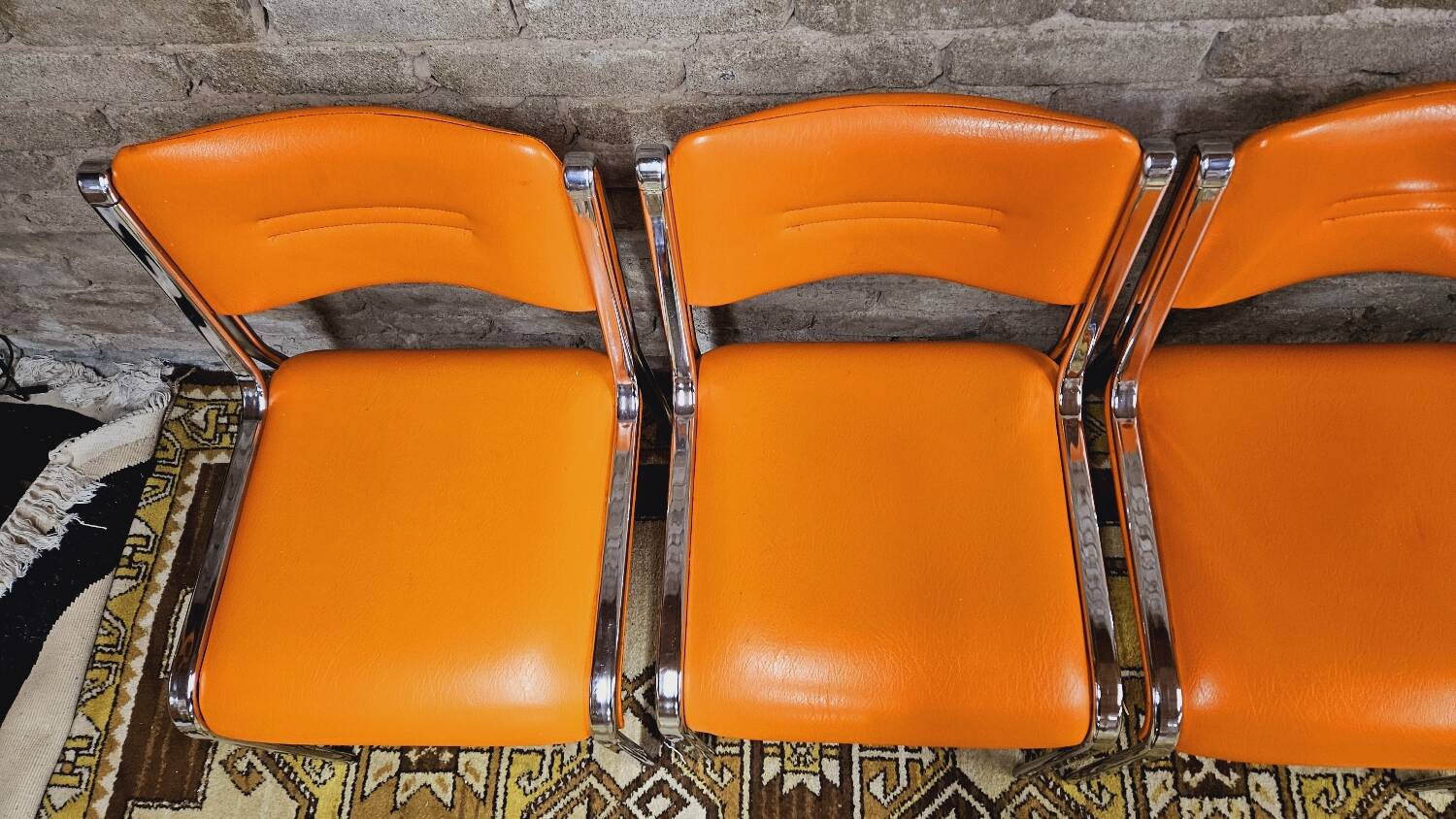 Set of 4 vintage chrome skai orange chairs 1970