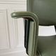 Vintage chair with green imitation leather armrests