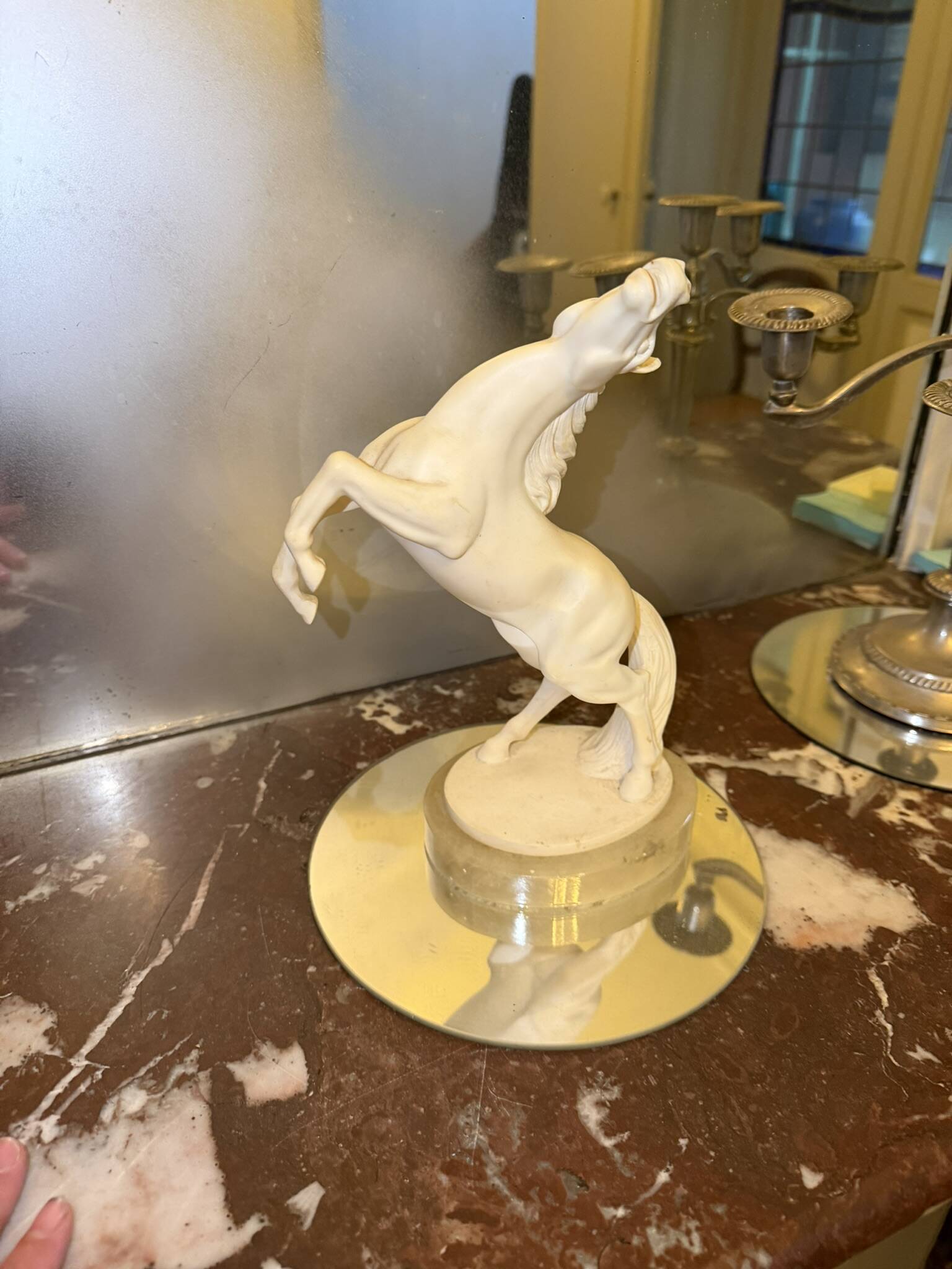 White rearing horse statuette
