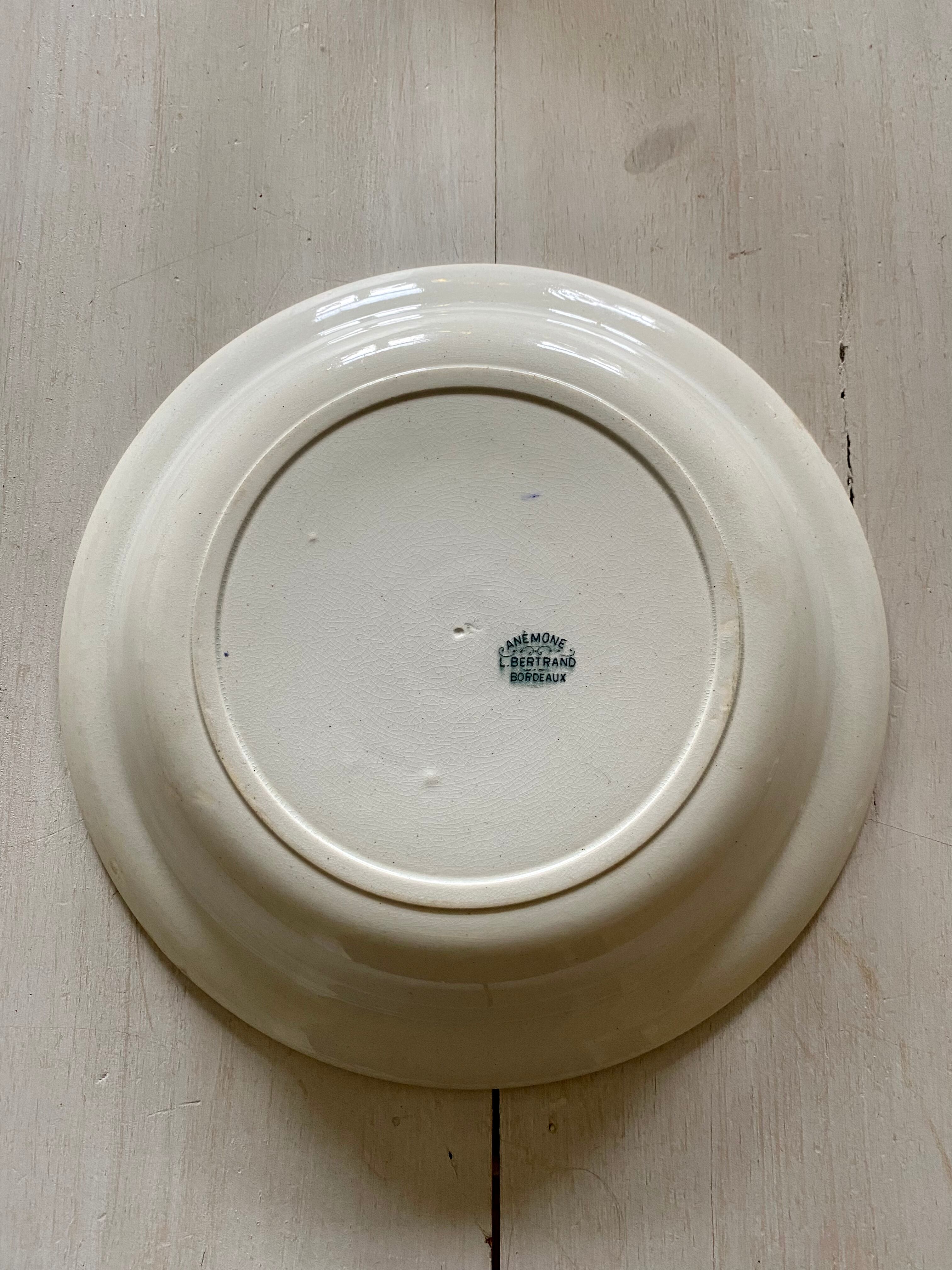 Round dish signed Bertrand Bordeaux model Anémone