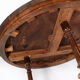 Round dining table of walnut with inlaid wood, 1890s