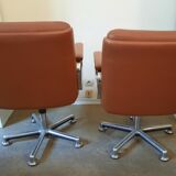 Brown leather armchairs