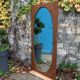 Miroir oval biseauté sur porte art déco Acajou 79x162