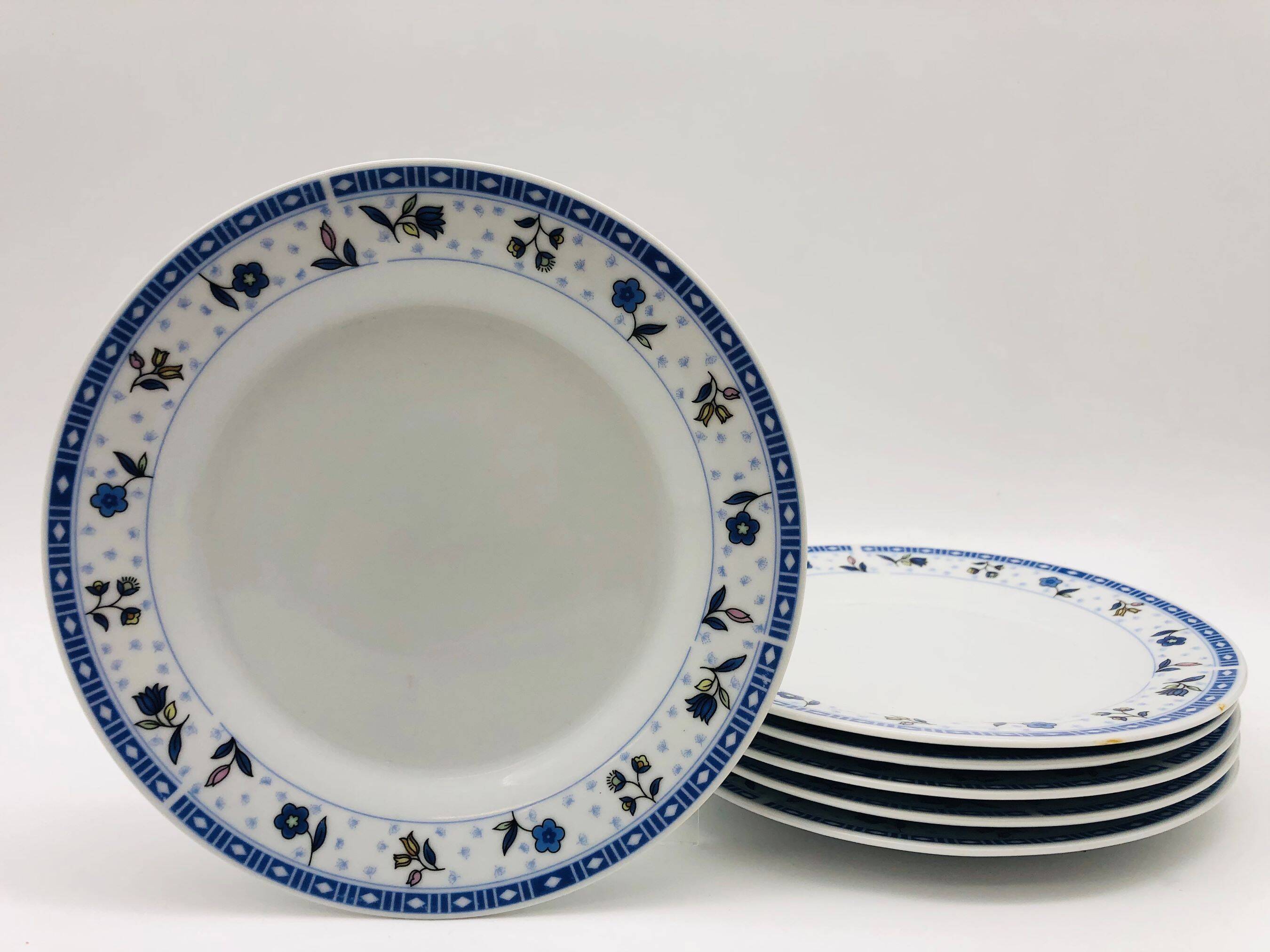 6 “Chriss G. Collection” porcelain dessert plates.