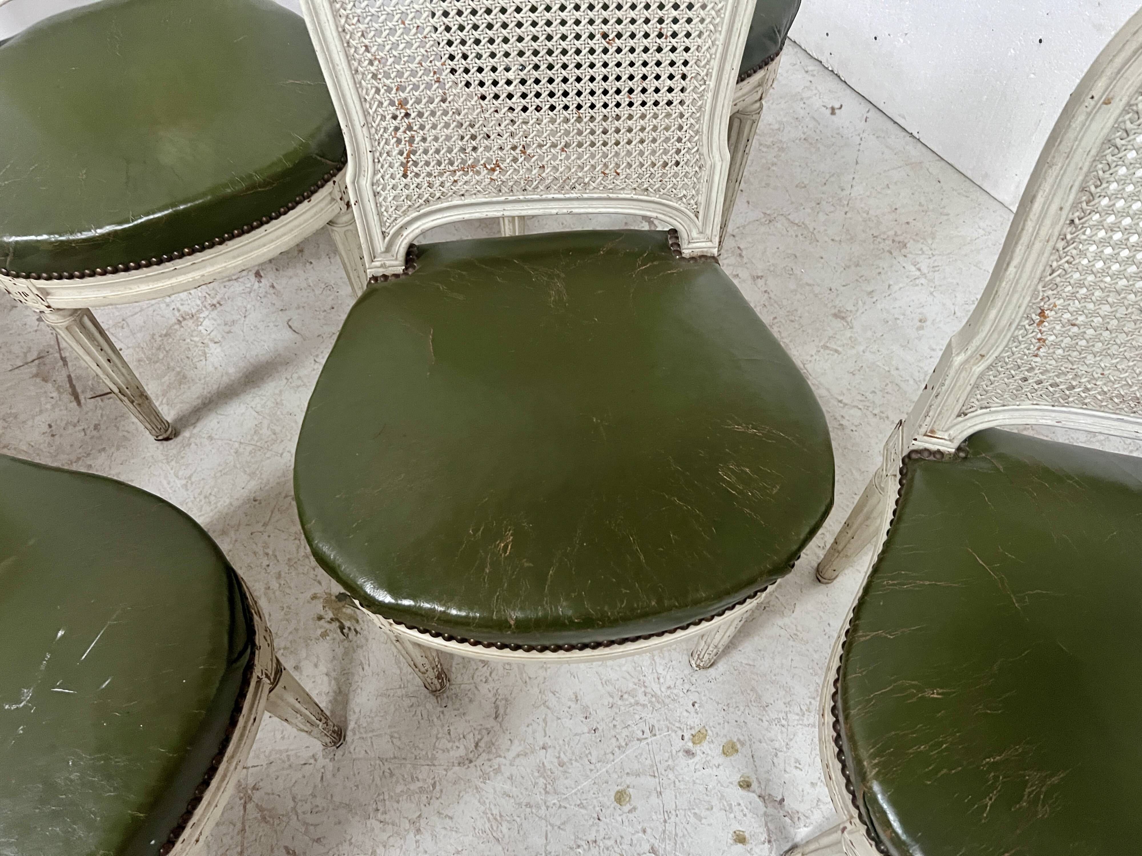 Set of seven Louis XVI style chairs in patinated beech, 20th century.
