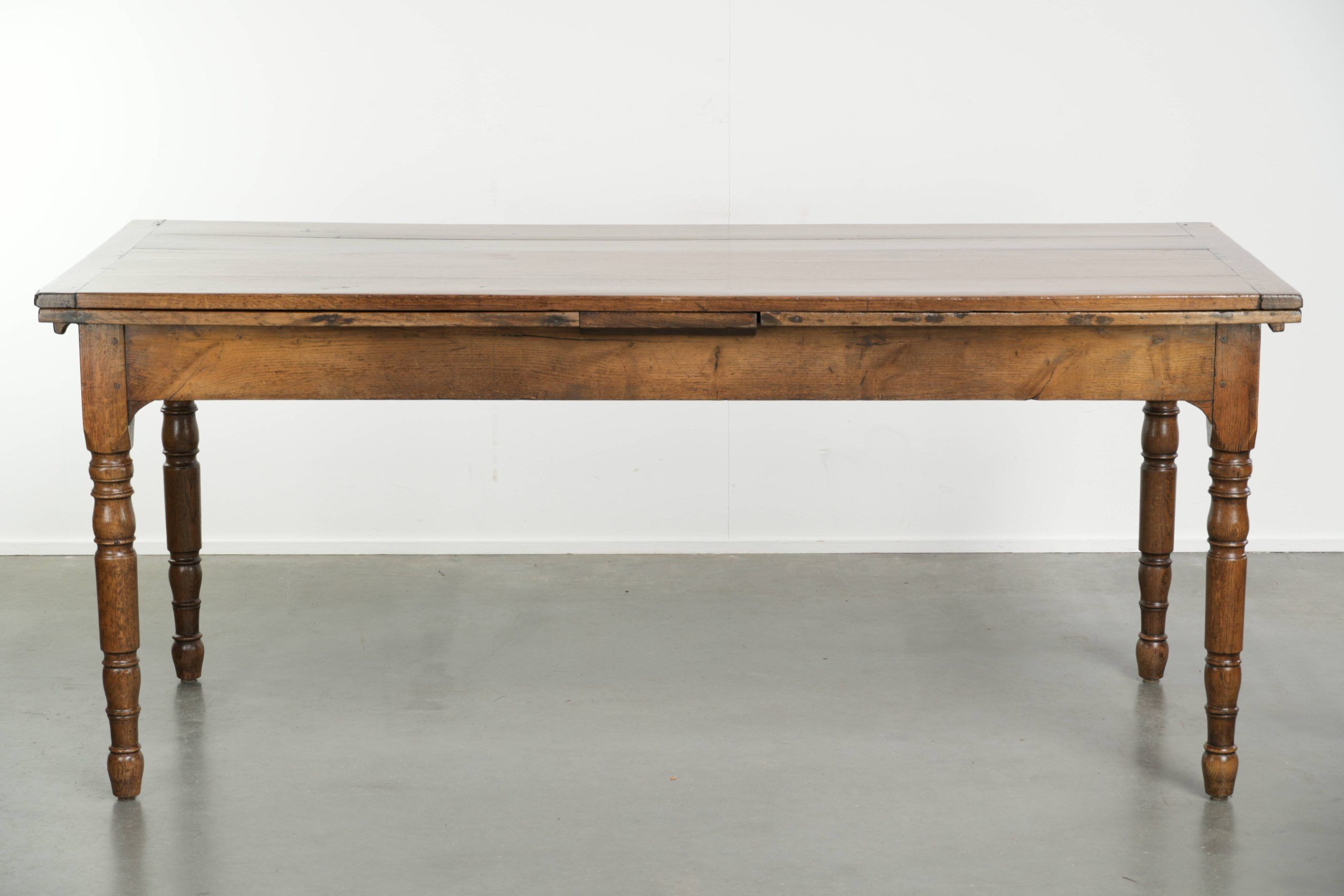 Antique oak dining table from the late 18th century with extendable leaves