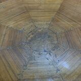 Tripod table with a sculpted top