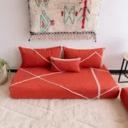 Handmade Moroccan floor cushion in orange cotton.