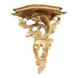 Golden console in rococo style