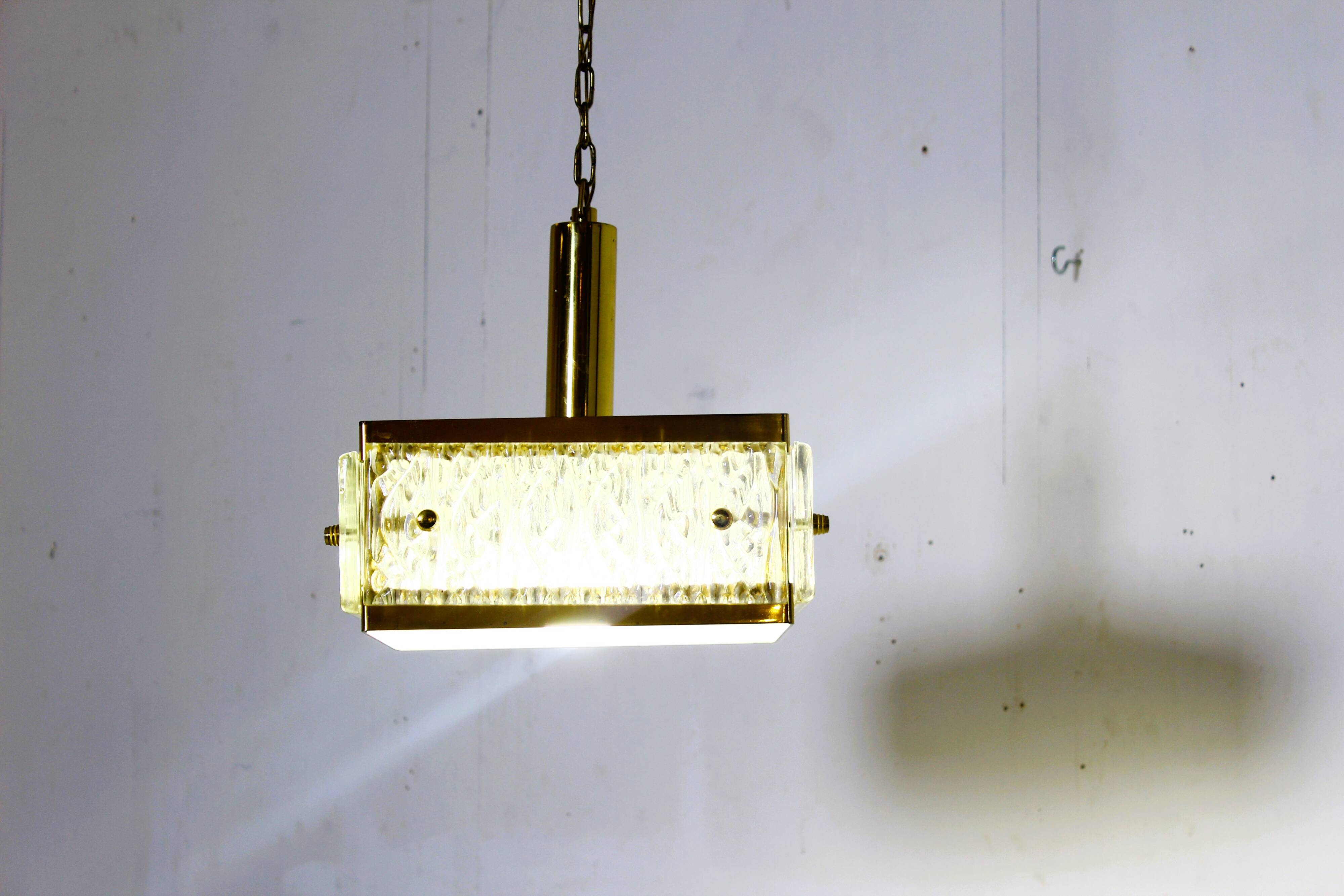 Vintage chandelier from Malmö Metallvarufabrik and pressed glass from Orrefors 1970s