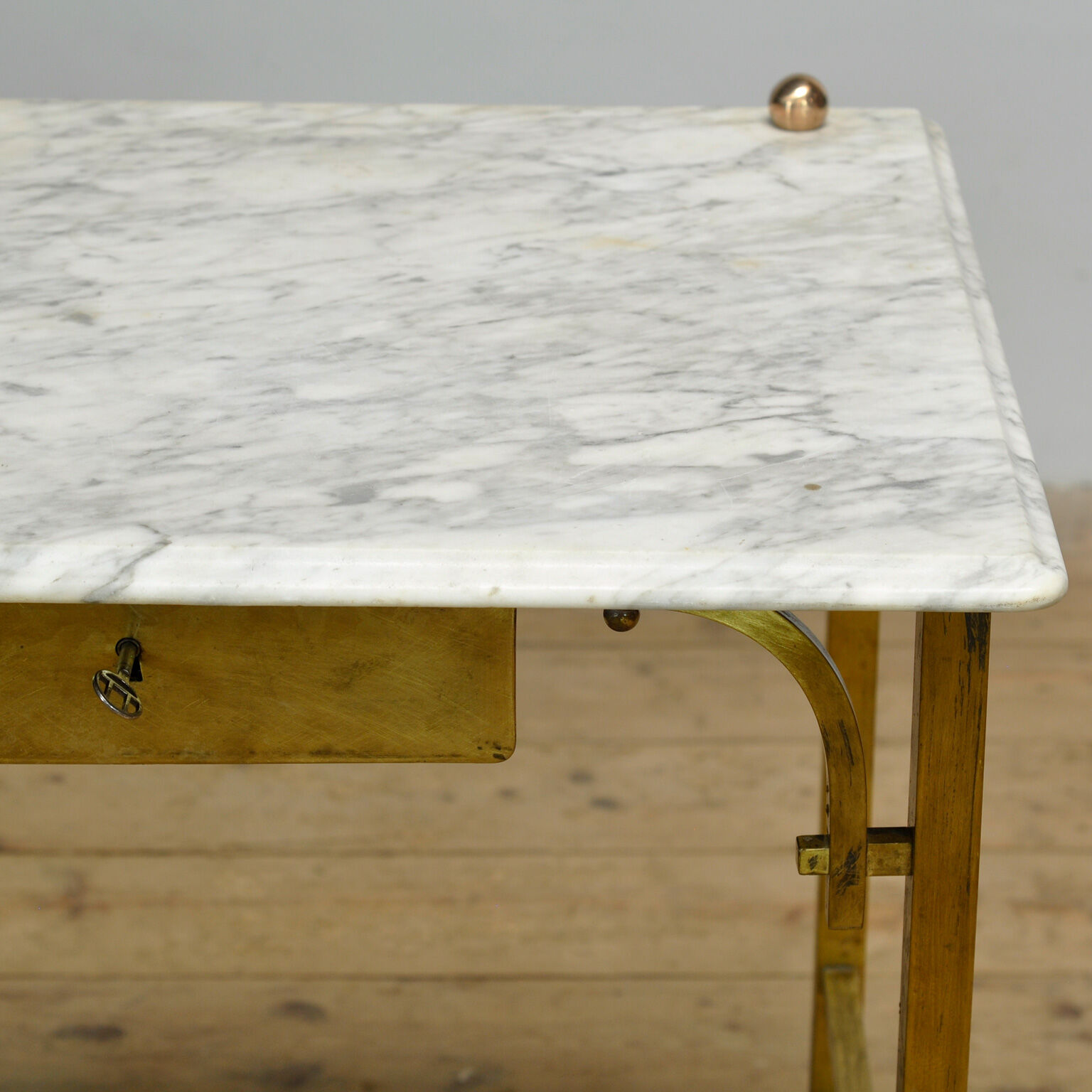 Small brass table with marble top, circa 1910