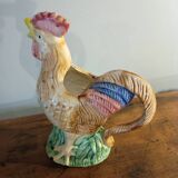 Vintage slipware jug in the shape of a rooster.