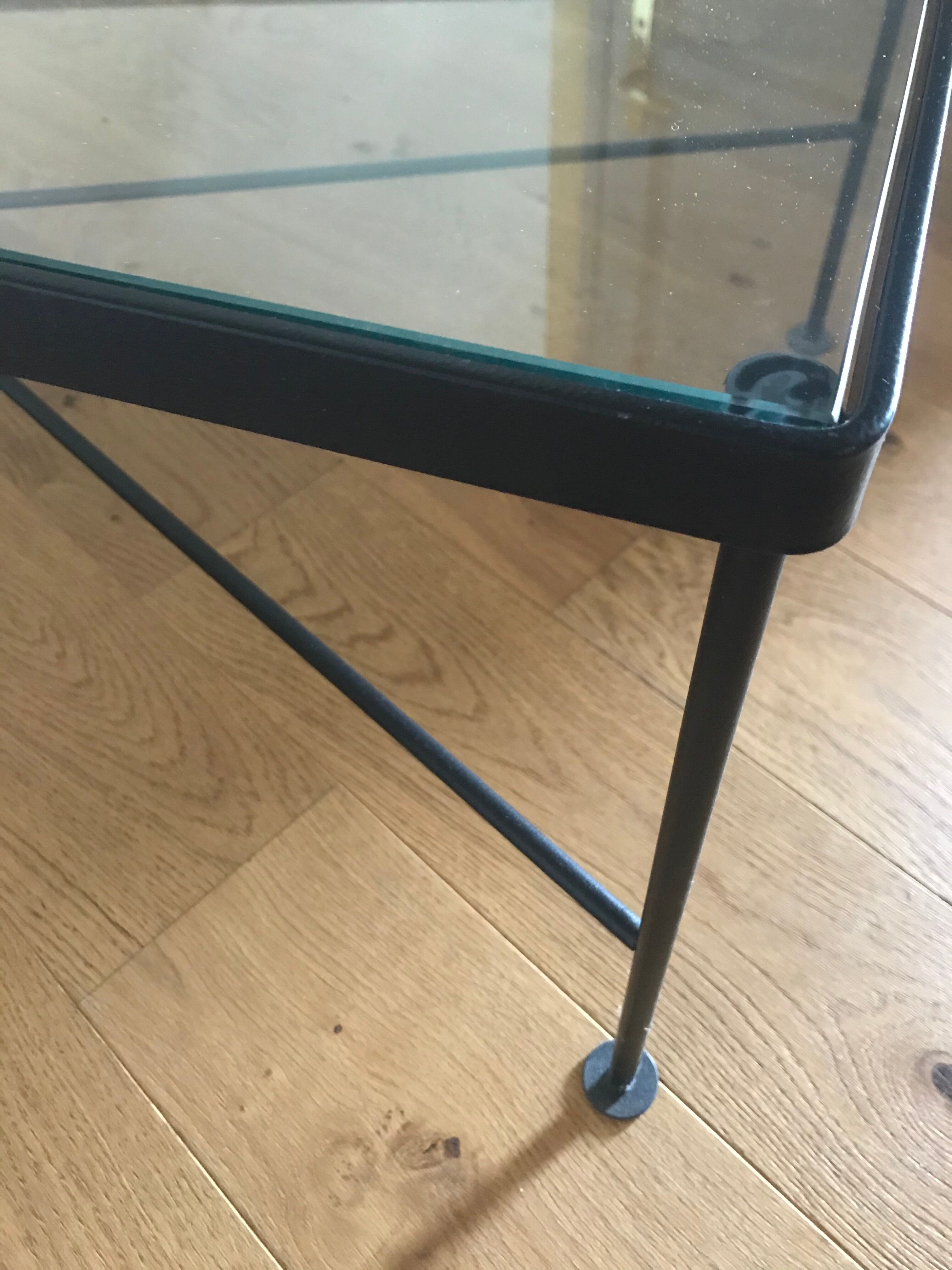 Glass and black metal coffee table