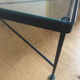 Glass and black metal coffee table