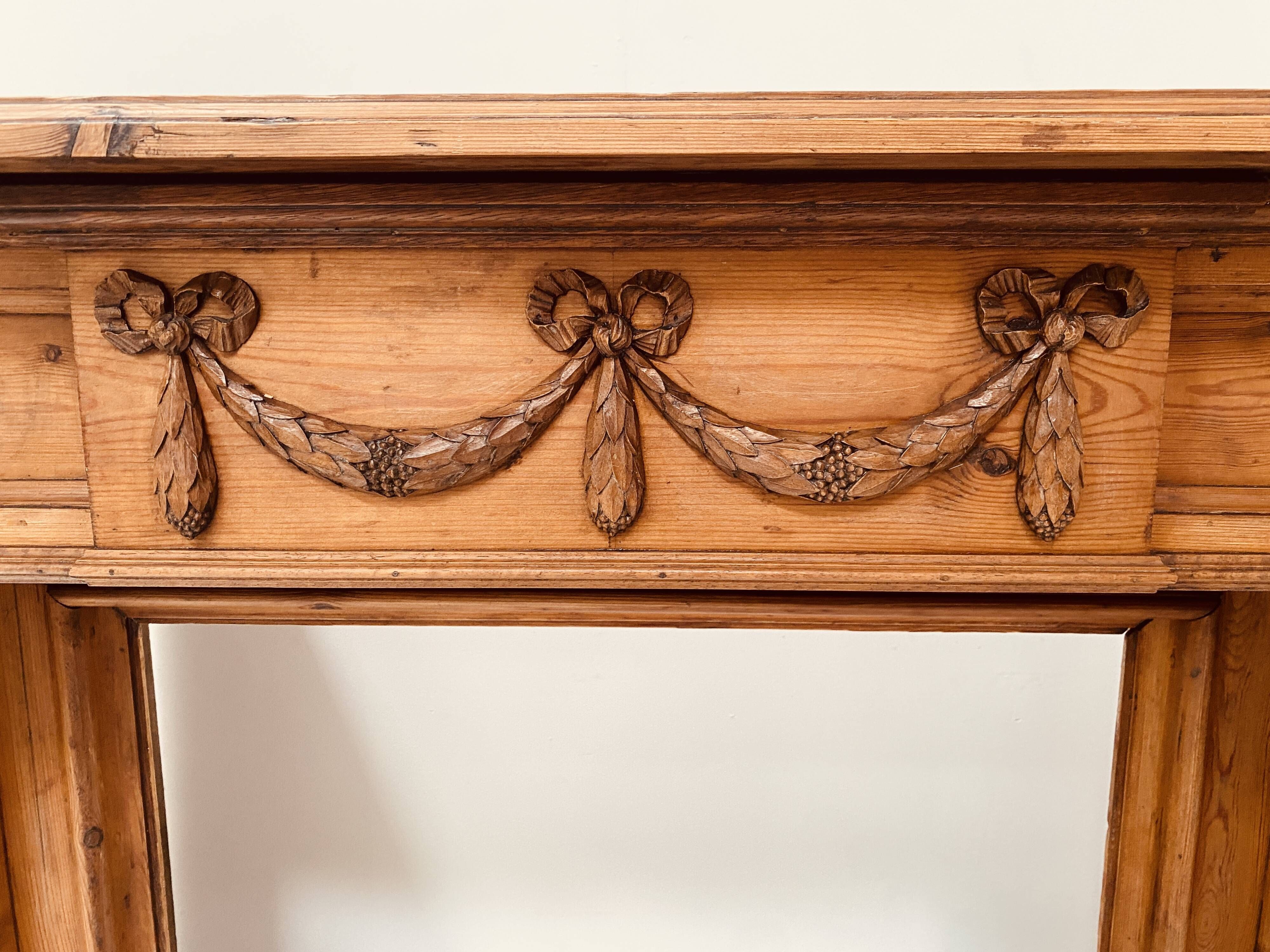 Louis XVI style fireplace in solid fir, 19th century.