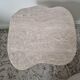 Alpha side table irregular natural travertine ribbed foot