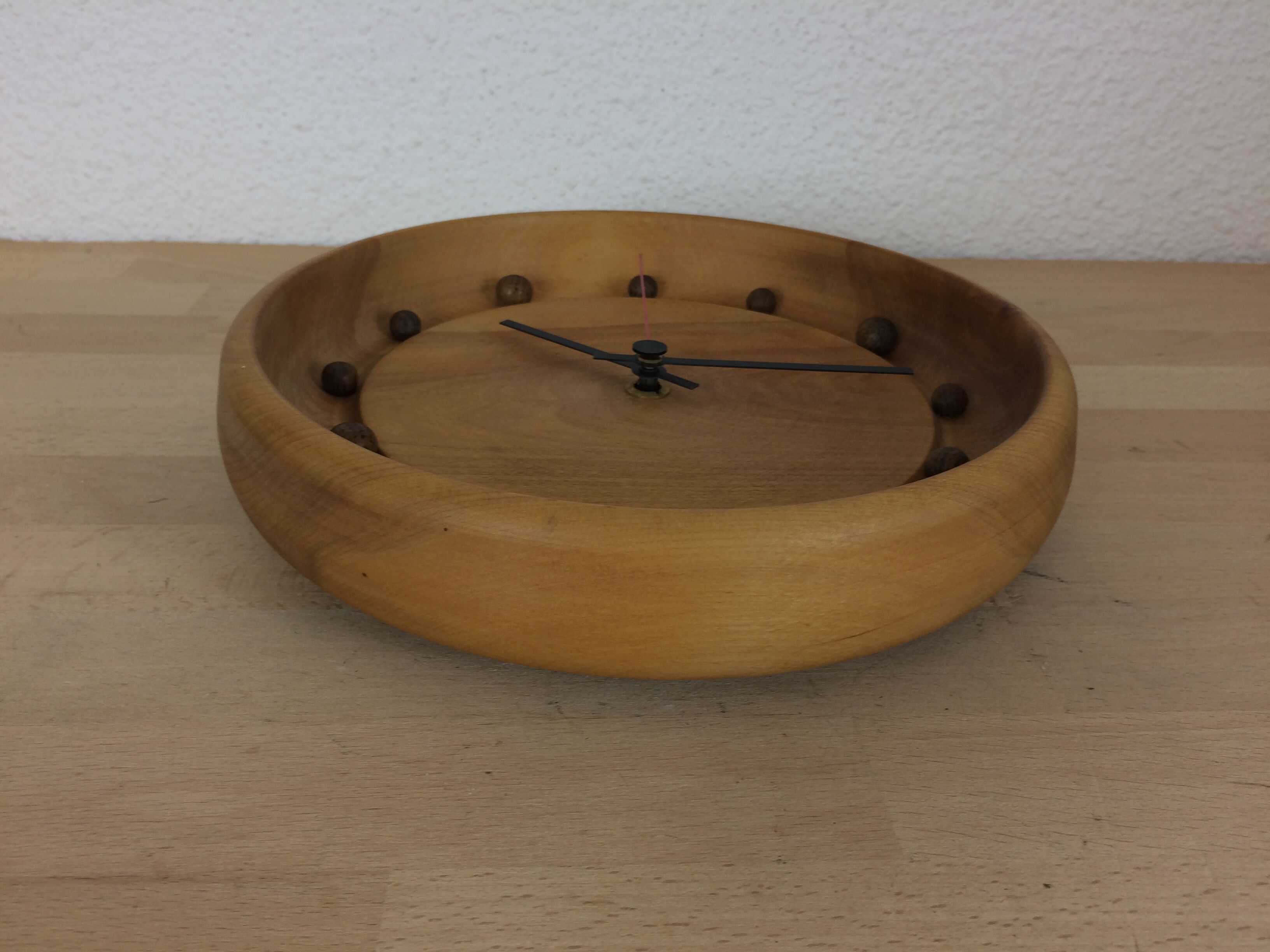 Wall clock in elm wood design