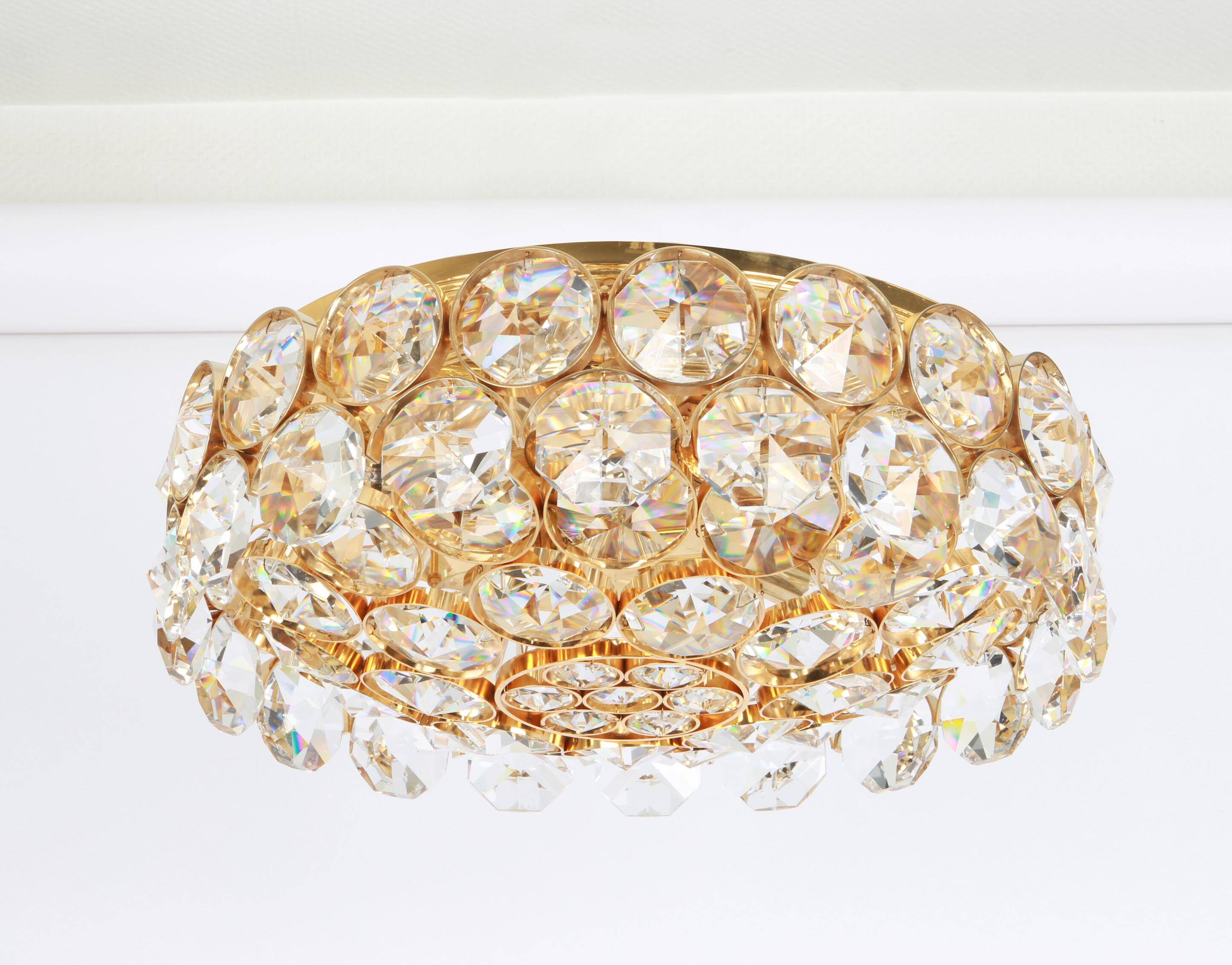 Chandelier in gilded brass and crystal glass inlaid by Palwa, Germany, 1970s.