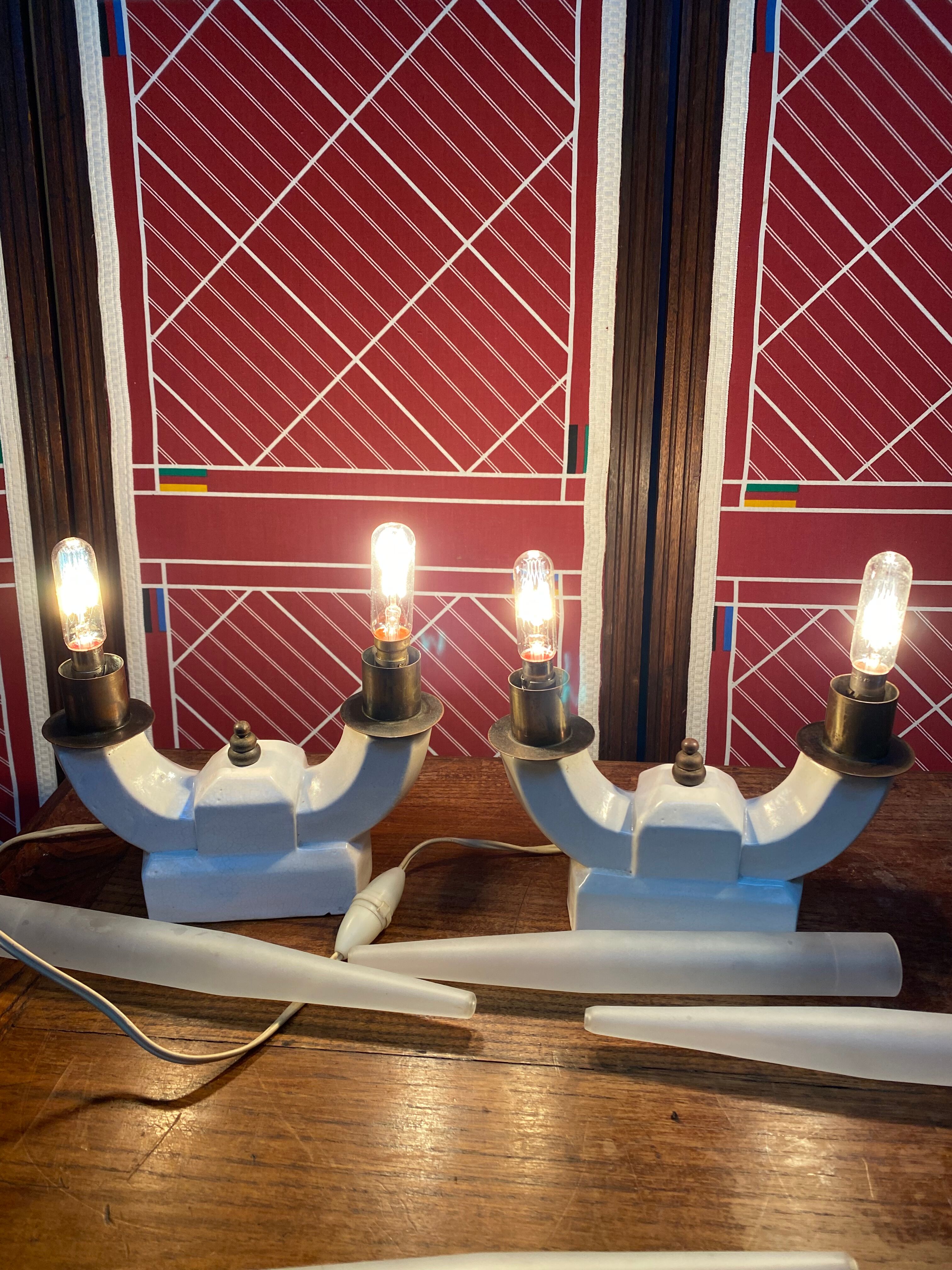 Pair of ceramic and brass office chandeliers