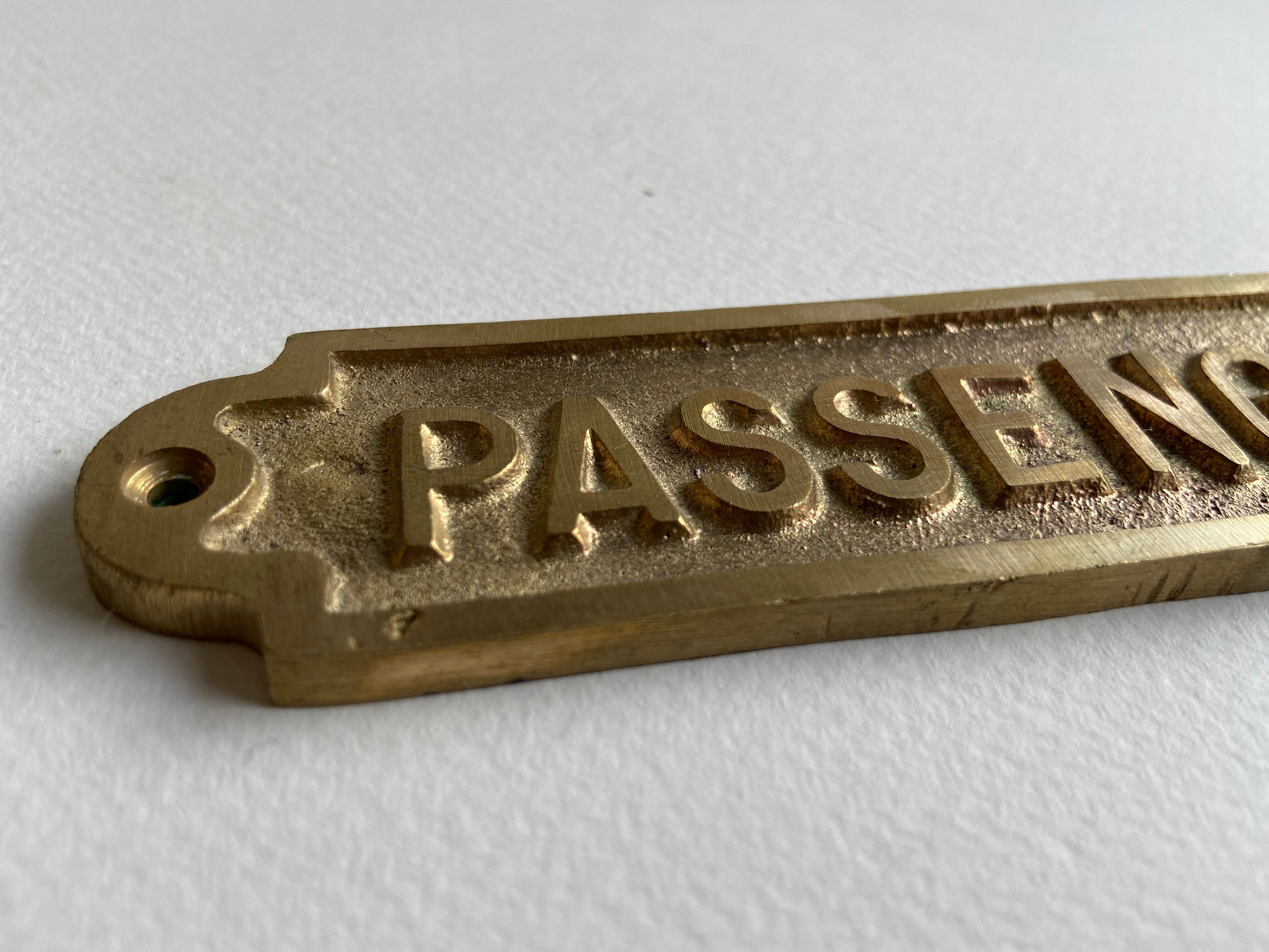"Passengers" gold brass plate