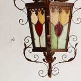 Wrought iron lantern and stained glass windows