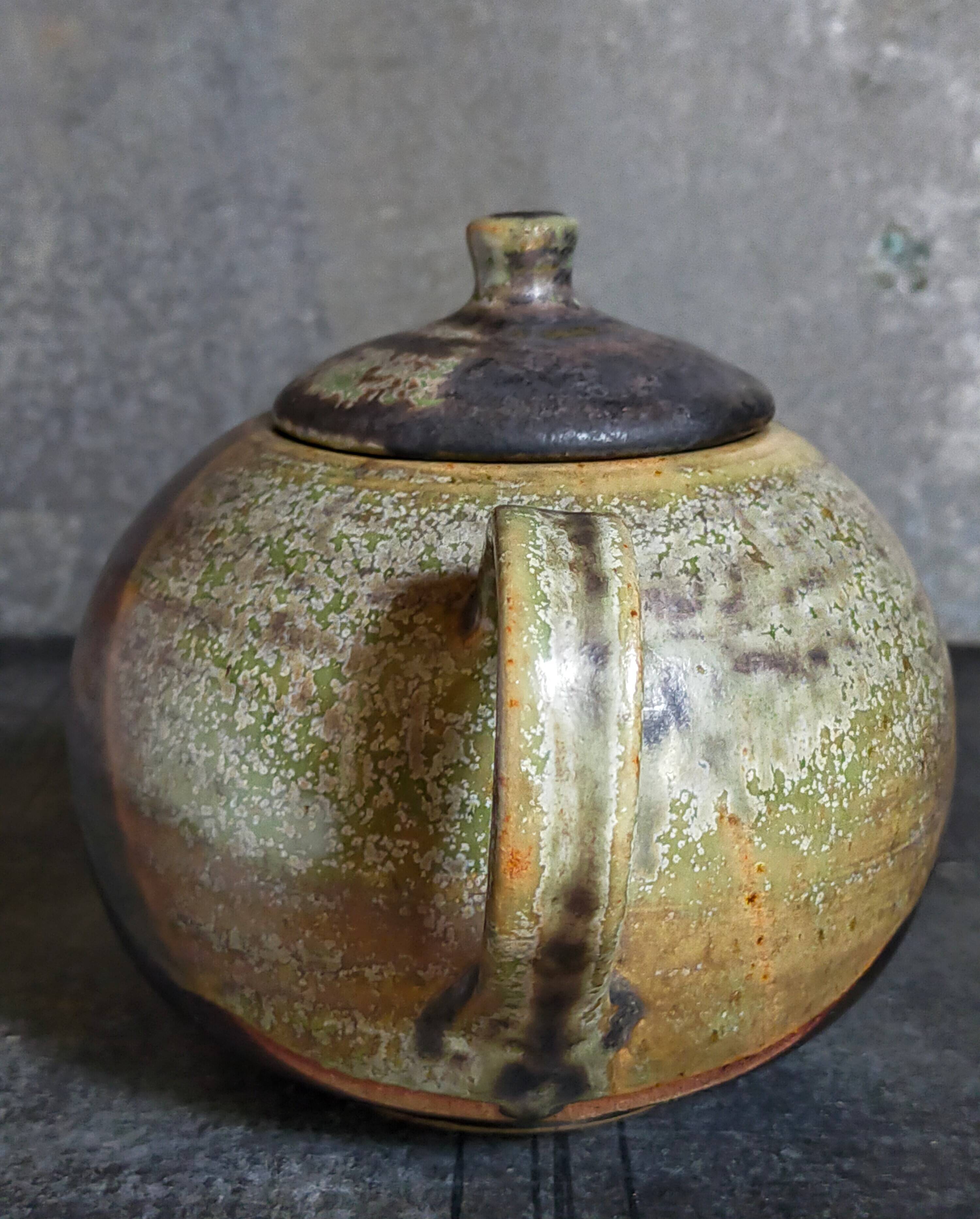 Vintage enameled stoneware potter's teapot