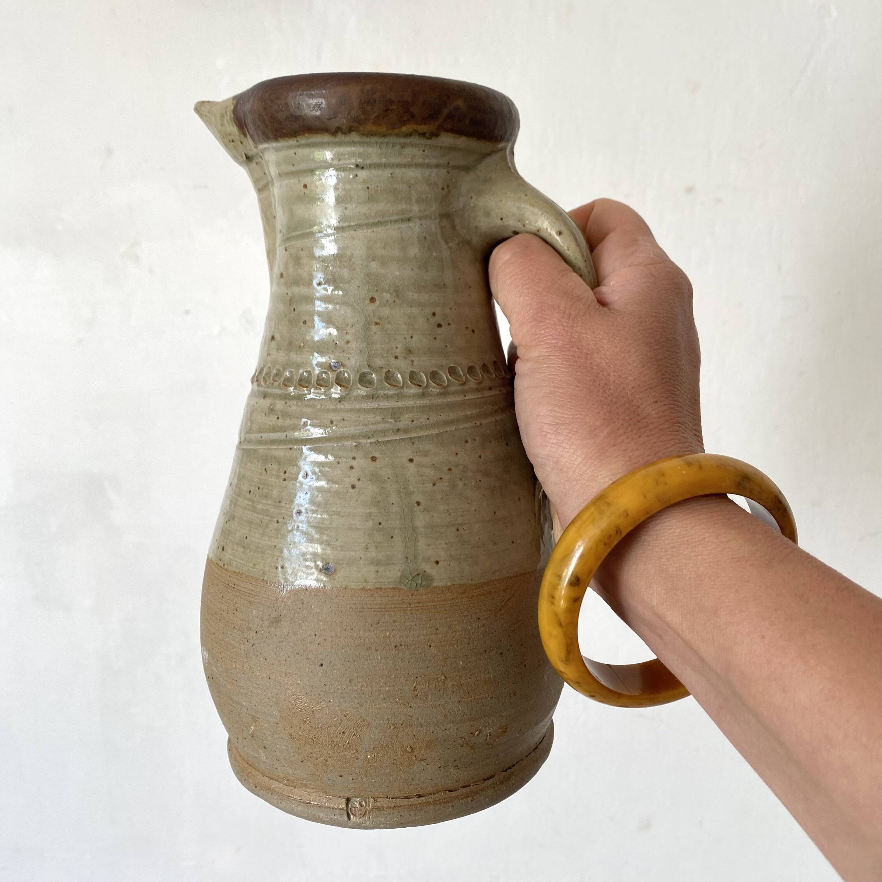 Vintage handcrafted terracotta pitcher