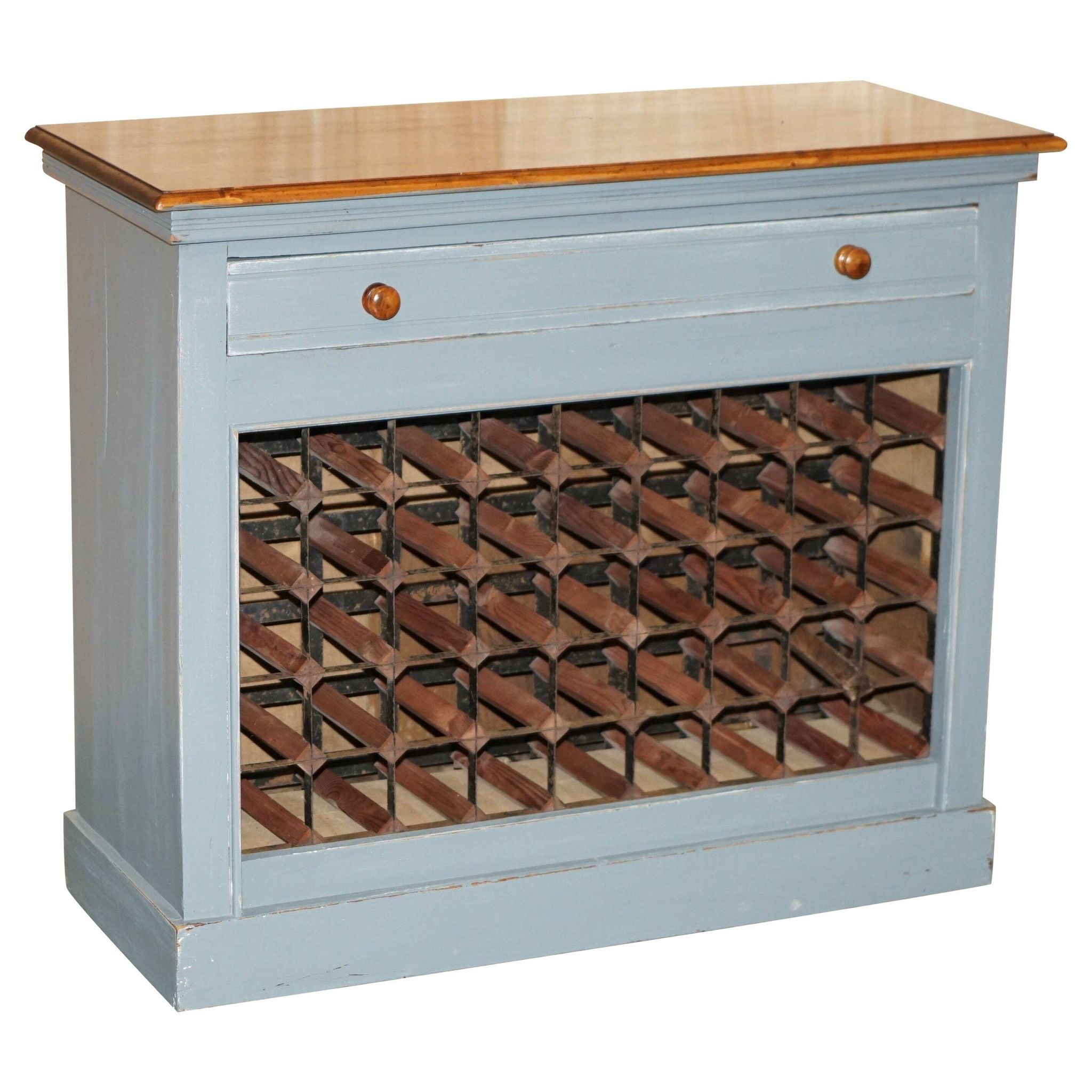 Vintage wooden furniture for 45 wine bottles with a drawer.