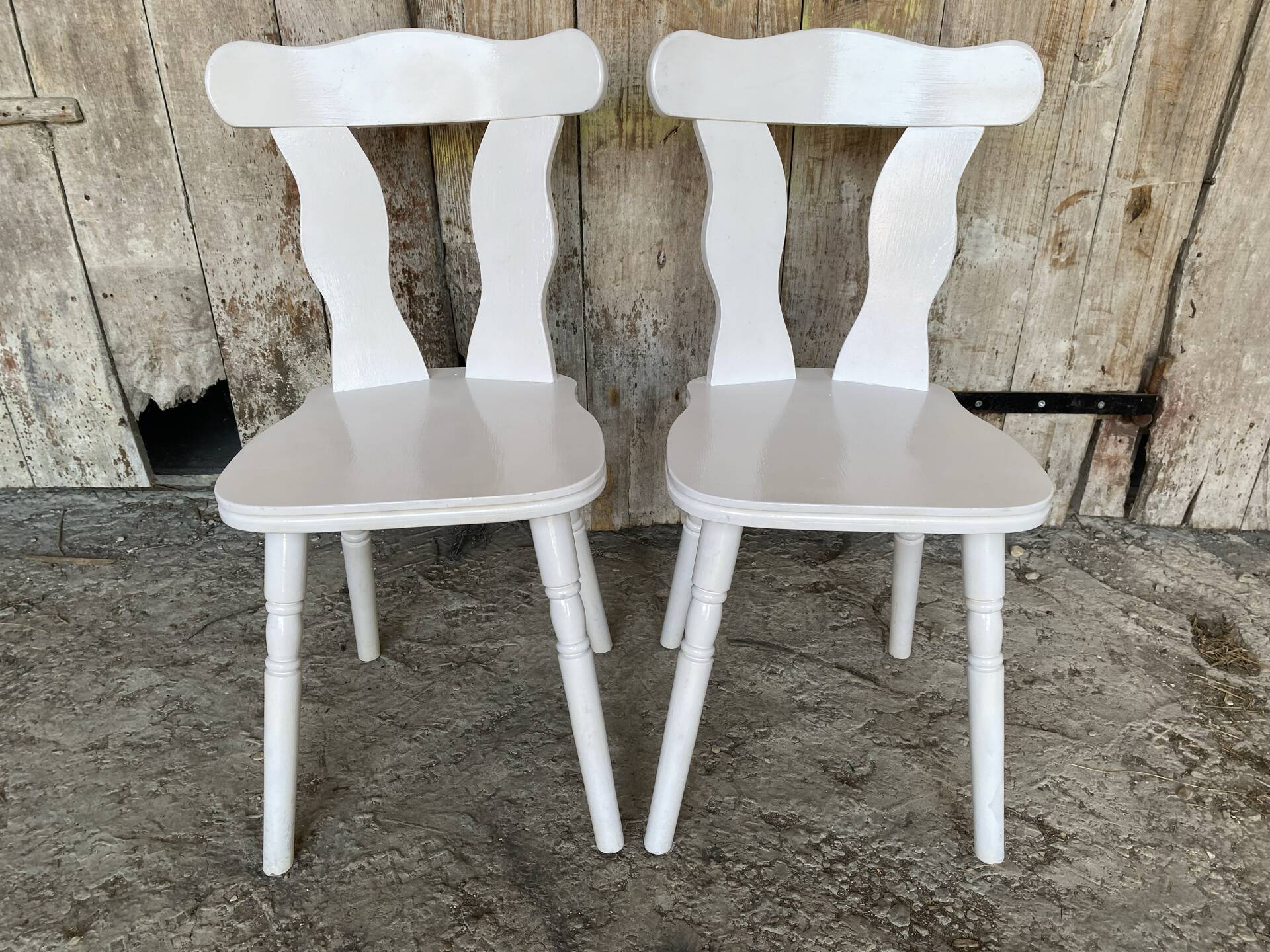Pair of vintage white wooden bistro chairs