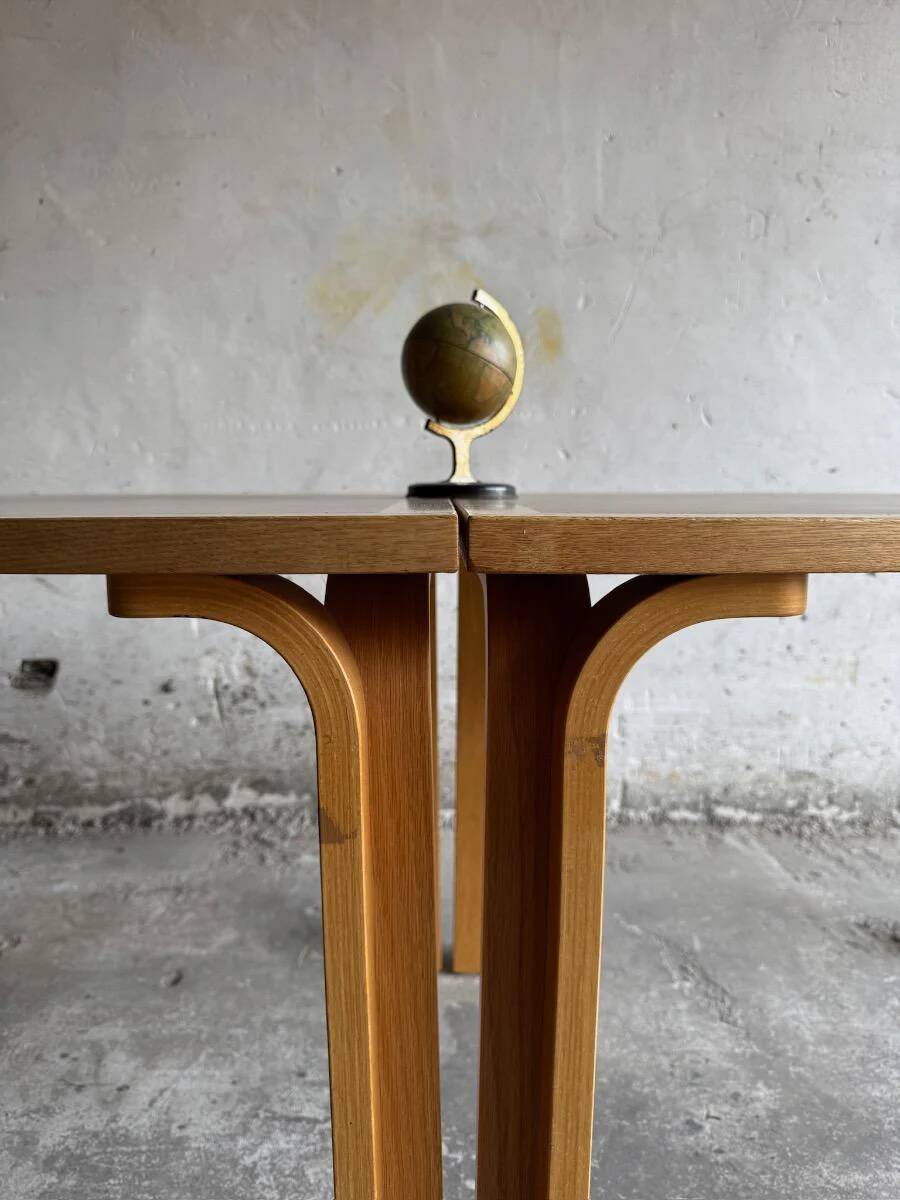 Set of 2 light-grey laminated and beech wood half-round dining tables by Magnus Olesen