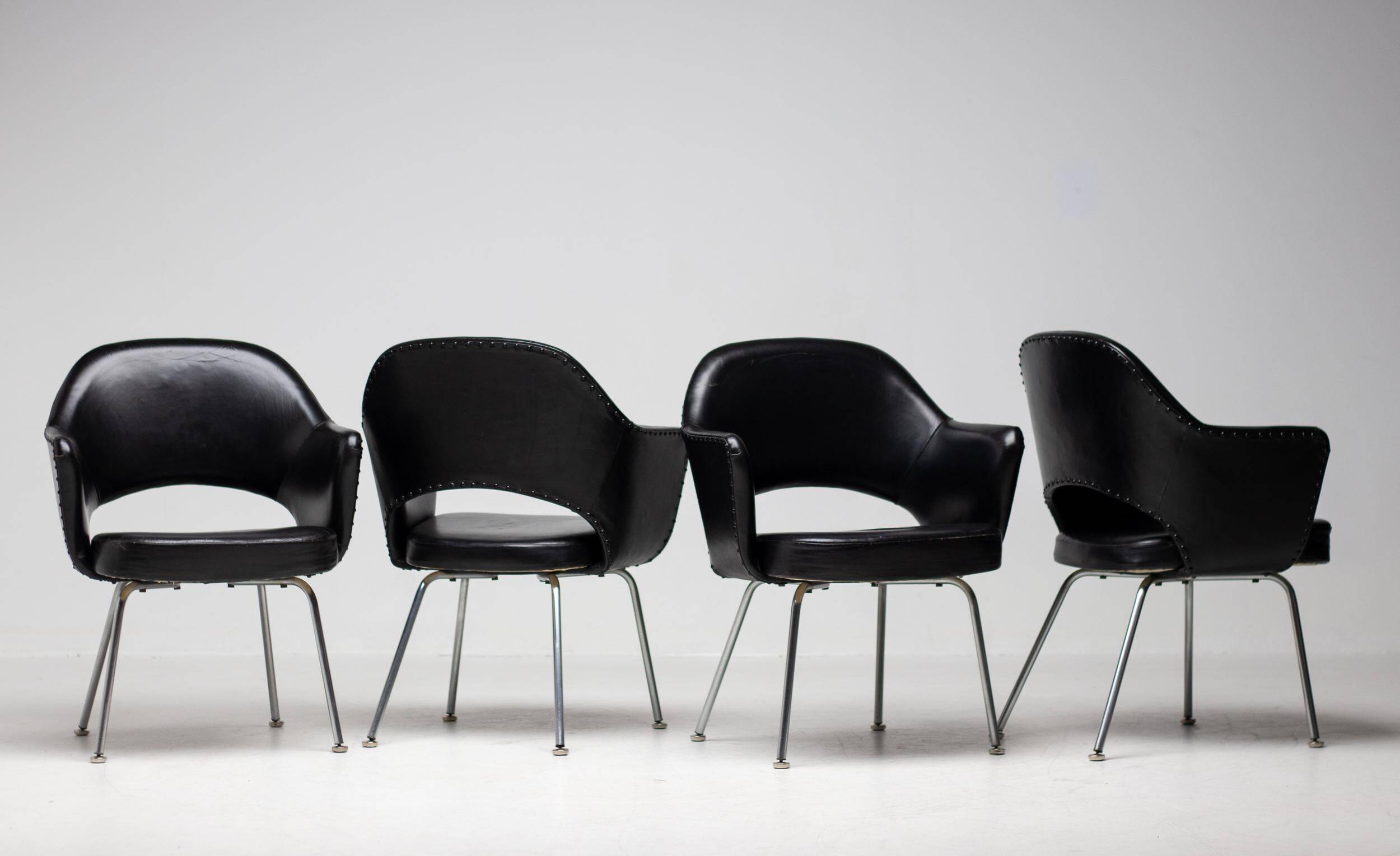 Set of 4 Saarinen executive chairs for Knoll in original black leather.
