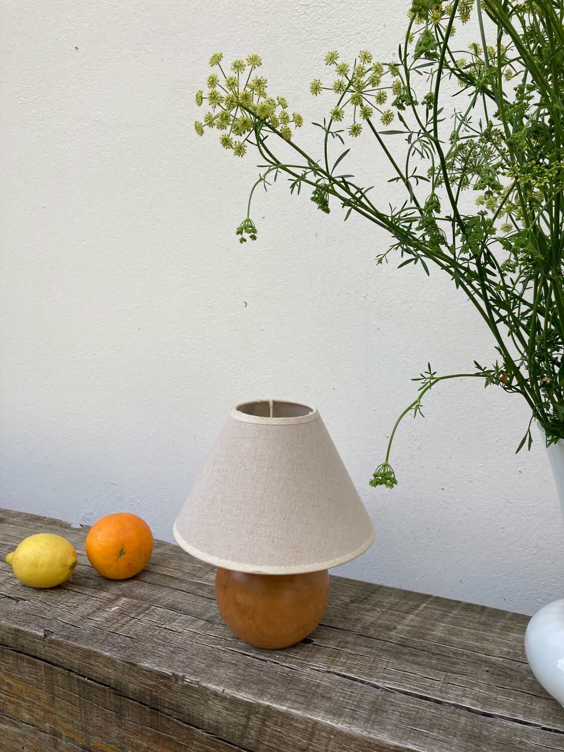 Wooden ball bedside lamp and beige lampshade