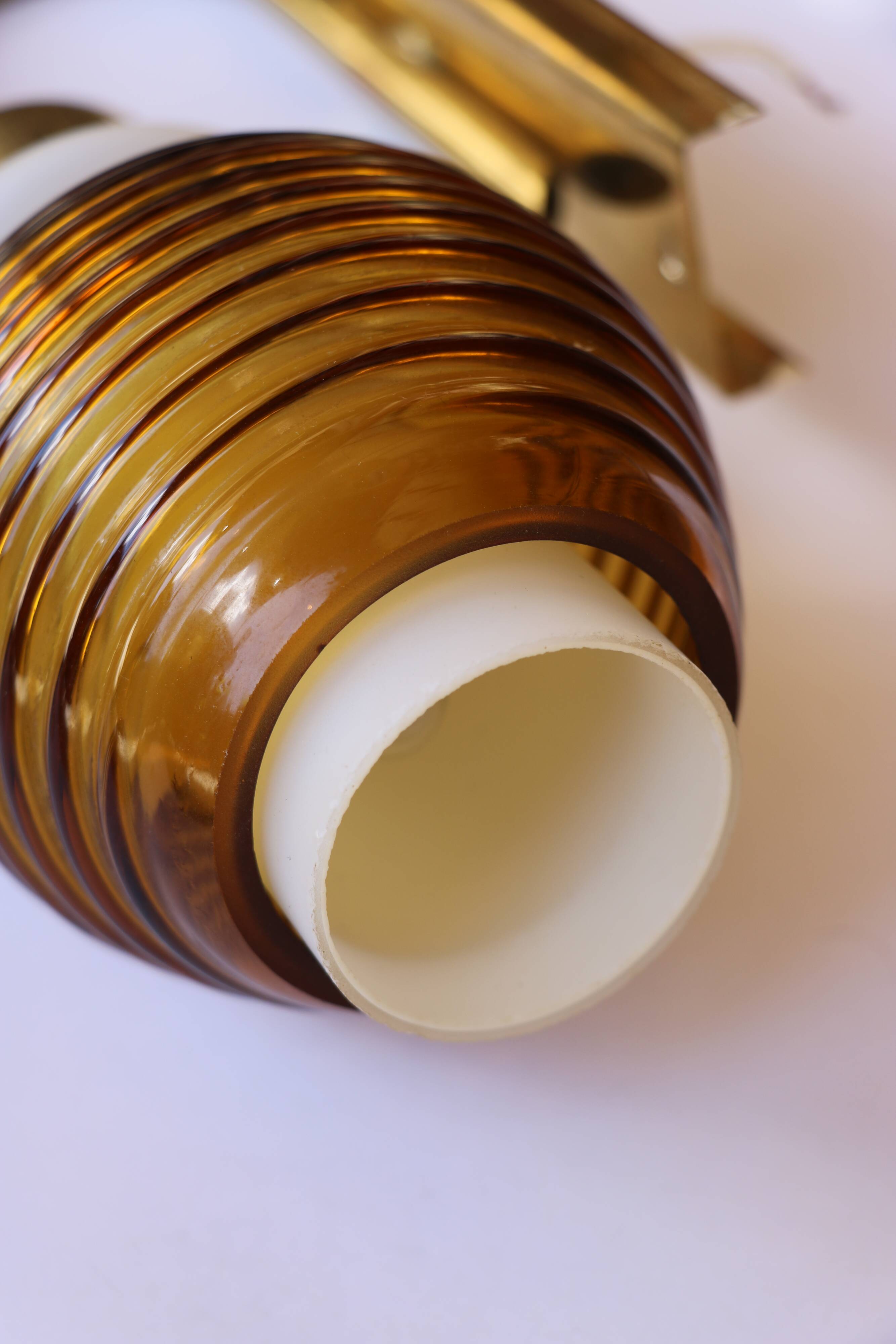 Pair of Scandinavian wall sconces, brass, opal glass and amber glass.